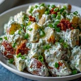 Hearty Juneteenth soul food potato salad, rich with celery, onions, and creamy dressing.