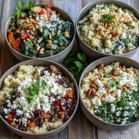 A vibrant Spinach and Feta Grain Bowl with sautéed greens and crumbled cheese, finished with a lemon dressing and fresh parsley garnish.